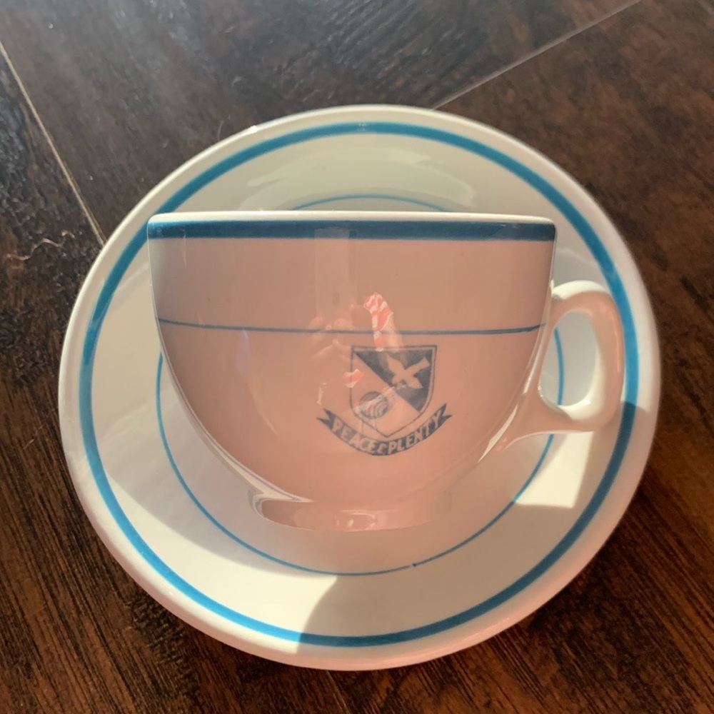 CUP & SAUCER FROM THE “ PEACE & PLENTY” RESORT